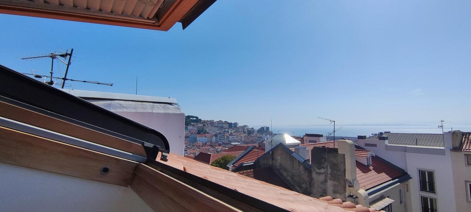 Quarto Aconchegante Com Varanda E Vista No Chiado Habitación en casa particular *